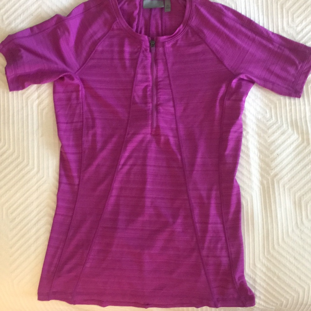 Athleta zip t with stash pocket in the back.